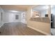 Living room featuring a breakfast bar, neutral colors, built-in shelves, and modern gray floors at 2817 Burton Nw Rd, Atlanta, GA 30311