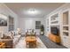 Comfortable living room features neutral colors, built-in shelves, and modern gray floors at 2817 Burton Nw Rd, Atlanta, GA 30311