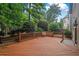 Inviting wooden backyard deck offering ample seating space bordered with lush, green landscaping at 3725 Paces Park Se Cir, Smyrna, GA 30080