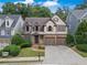 Charming home featuring two-car garage, manicured lawn and inviting front entrance at 3725 Paces Park Se Cir, Smyrna, GA 30080