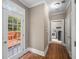Hallway with access to a rear wood deck and the laundry room at 3725 Paces Park Se Cir, Smyrna, GA 30080