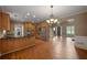 Spacious kitchen with island, hardwood floors, stainless steel appliances, and a view to living room at 3725 Paces Park Se Cir, Smyrna, GA 30080
