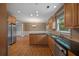 Spacious kitchen featuring stainless steel appliances, wood cabinets, and dark countertops at 3725 Paces Park Se Cir, Smyrna, GA 30080