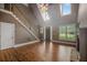 Bright living room with fireplace, staircase, hardwood floors and large windows at 3725 Paces Park Se Cir, Smyrna, GA 30080