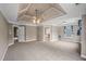 Spacious main bedroom featuring tray ceiling, neutral carpet and plentiful natural light at 3725 Paces Park Se Cir, Smyrna, GA 30080