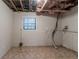 Unfinished basement area with exposed ceiling, ductwork, concrete block walls, and linoleum flooring at 5218 Tina Ct, Stone Mountain, GA 30083
