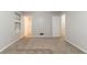 Spacious bedroom with neutral walls, carpet flooring, and a bright window at 5218 Tina Ct, Stone Mountain, GA 30083