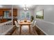 Dining room with table, chairs, and adjacent updated kitchen at 5218 Tina Ct, Stone Mountain, GA 30083