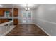 Dining area with updated light fixture and view of spacious backyard at 5218 Tina Ct, Stone Mountain, GA 30083