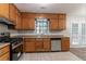 Functional kitchen featuring stainless steel appliances, practical countertops, and ample cabinet space at 5218 Tina Ct, Stone Mountain, GA 30083