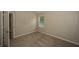 This carpeted bedroom features a window for natural light and neutral walls at 545 Offaly Ln, Atlanta, GA 30349