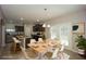 Staged kitchen and dining area filled with natural light and views of the backyard at 545 Offaly Ln, Atlanta, GA 30349