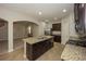 Modern kitchen features a granite island, stainless steel appliances, and ample cabinet space at 545 Offaly Ln, Atlanta, GA 30349