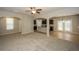 Open-concept living room and kitchen area filled with natural light and neutral color palette at 545 Offaly Ln, Atlanta, GA 30349