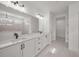 Bright bathroom featuring a double vanity, sleek countertops, and modern fixtures at 2012 Ripple Park Bend, Canton, GA 30114