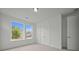 Neutral bedroom with natural light and closet at 2012 Ripple Park Bend, Canton, GA 30114