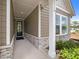 Inviting front entrance showcasing stone accents and a well-lit walkway to a sleek front door at 2012 Ripple Park Bend, Canton, GA 30114
