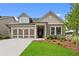 Charming single-Gathering home featuring a well-maintained lawn and a welcoming two-car garage at 2012 Ripple Park Bend, Canton, GA 30114