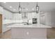 Bright kitchen with large center island and modern pendant lighting at 2012 Ripple Park Bend, Canton, GA 30114
