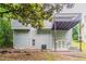 Two-story home featuring a backyard with a deck and French doors leading to a patio at 2654 Laurel View Dr, Snellville, GA 30039