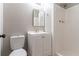 This bathroom features a shower, toilet, vanity and mirror at 2654 Laurel View Dr, Snellville, GA 30039
