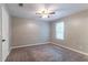 Comfortable bedroom with a ceiling fan, neutral walls, plush carpeting and a large window for natural light at 2654 Laurel View Dr, Snellville, GA 30039