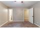 Spacious bedroom with soft carpeting, neutral walls, and two doors offering ensuite bathroom and closet access at 2654 Laurel View Dr, Snellville, GA 30039