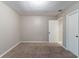 Spacious bedroom with soft carpeting, neutral walls, ensuite bathroom and ample closet space, ideal for relaxation at 2654 Laurel View Dr, Snellville, GA 30039