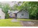 Charming single-story home featuring stone accents, a cozy front porch, and a well-maintained lawn at 2654 Laurel View Dr, Snellville, GA 30039