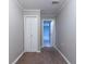 A carpeted hallway features access to rooms and storage at 2654 Laurel View Dr, Snellville, GA 30039