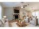 Inviting living room boasts a stone fireplace, neutral decor, and ample natural light at 2654 Laurel View Dr, Snellville, GA 30039