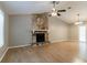 Spacious living room featuring vaulted ceiling, a stone fireplace, and modern flooring at 2654 Laurel View Dr, Snellville, GA 30039