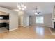 Open-concept living area features fireplace, modern lighting, and easy access to kitchen at 2654 Laurel View Dr, Snellville, GA 30039