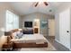 Staged bedroom showcases a modern bed frame, blue accents, and bathroom access, highlighting style and functionality at 2654 Laurel View Dr, Snellville, GA 30039