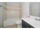 Bathroom with shower-tub, white toilet, and black vanity with white sink at 2799 Lake Jodeco Rd, Jonesboro, GA 30236
