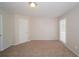 Empty bedroom with neutral carpet, walls and a window at 2799 Lake Jodeco Rd, Jonesboro, GA 30236