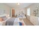 A stylish staged bedroom features playful decor and plenty of space at 2799 Lake Jodeco Rd, Jonesboro, GA 30236