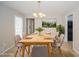 Staged dining area with wood table, modern chandelier, and an inviting atmosphere at 2799 Lake Jodeco Rd, Jonesboro, GA 30236