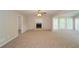 Spacious living room featuring a fireplace and large windows providing natural light at 2799 Lake Jodeco Rd, Jonesboro, GA 30236