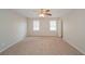 Spacious main bedroom with neutral walls, carpet flooring, and natural lighting at 2799 Lake Jodeco Rd, Jonesboro, GA 30236