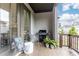 Inviting outdoor balcony with grill, seating, and green plants, perfect for relaxing and entertaining at 3900 Danube Ln, Atlanta, GA 30339