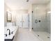 Bathroom features a tub, walk-in shower with glass door, and double vanity at 3900 Danube Ln, Atlanta, GA 30339