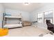 Bedroom with bunk beds, desk, and sitting area with natural lighting at 3900 Danube Ln, Atlanta, GA 30339