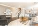 Open-concept living room featuring hardwood floors, stairs, and contemporary decor at 3900 Danube Ln, Atlanta, GA 30339