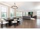 Open living area with a dining table, chandelier, and lots of natural light at 3900 Danube Ln, Atlanta, GA 30339