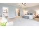 Expansive main bedroom boasts a seating area, ensuite bathroom, and neutral tones at 3900 Danube Ln, Atlanta, GA 30339