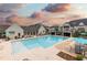 Community pool with lounge chairs, umbrellas, and covered seating areas, perfect for relaxing by the water at 3900 Danube Ln, Atlanta, GA 30339
