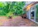 Wooden deck, bench seating, and sliding door to the home at 4766 White Oak Path, Stone Mountain, GA 30088
