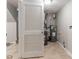 Basement featuring a water heater, furnace, and an access door at 4766 White Oak Path, Stone Mountain, GA 30088