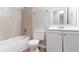 Bathroom featuring a bathtub, toilet, vanity with mirror, and coordinated fixtures at 4766 White Oak Path, Stone Mountain, GA 30088